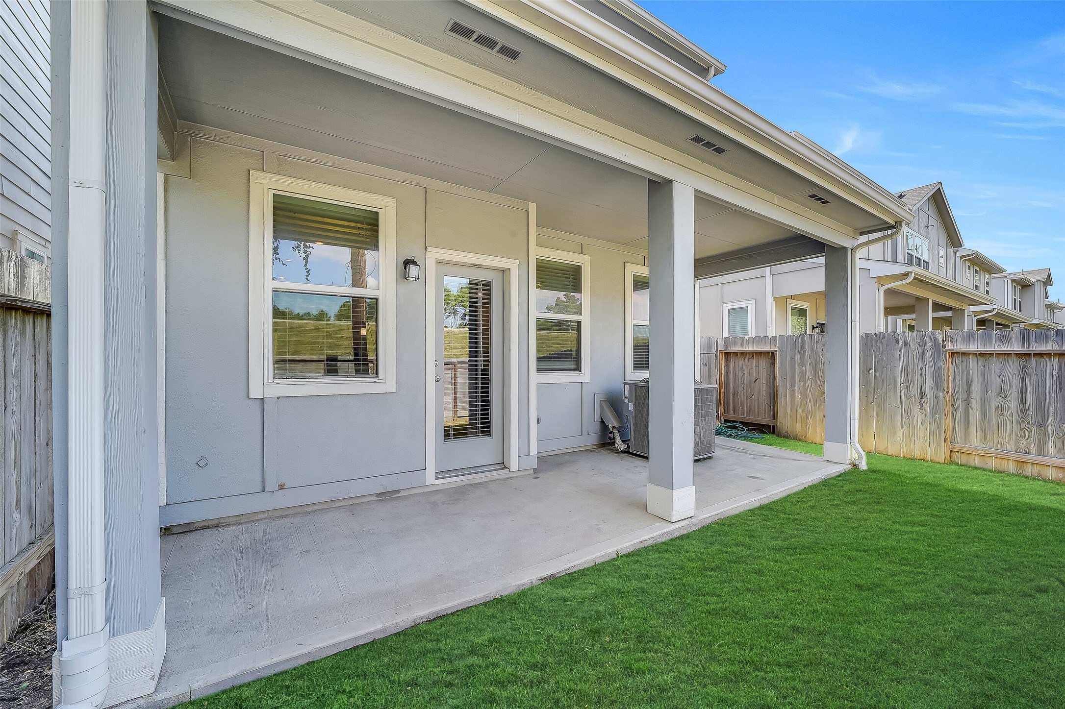 Just outside the breakfast area, this covered patio offers a welcoming spot for morning coffee or a quiet evening outdoors.