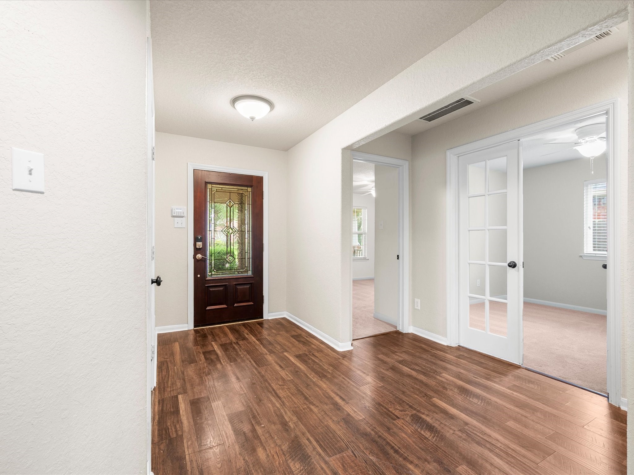 Beautiful vinyl plank flooring extends throughout the main living areas, offering durability, easy maintenance, and a timeless look.