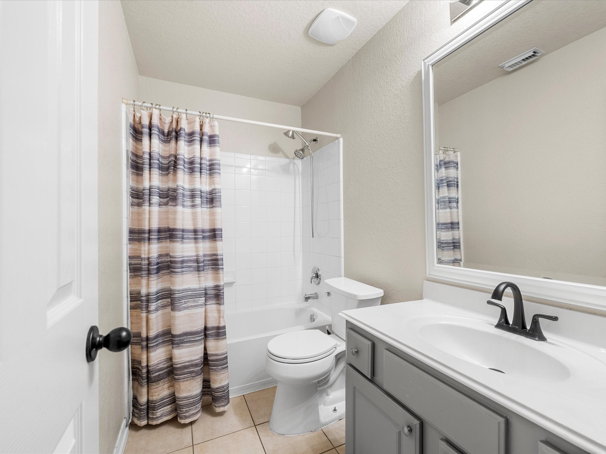 The full secondary bathroom offers functionality and convenience with a well-designed layout for family members or guests.