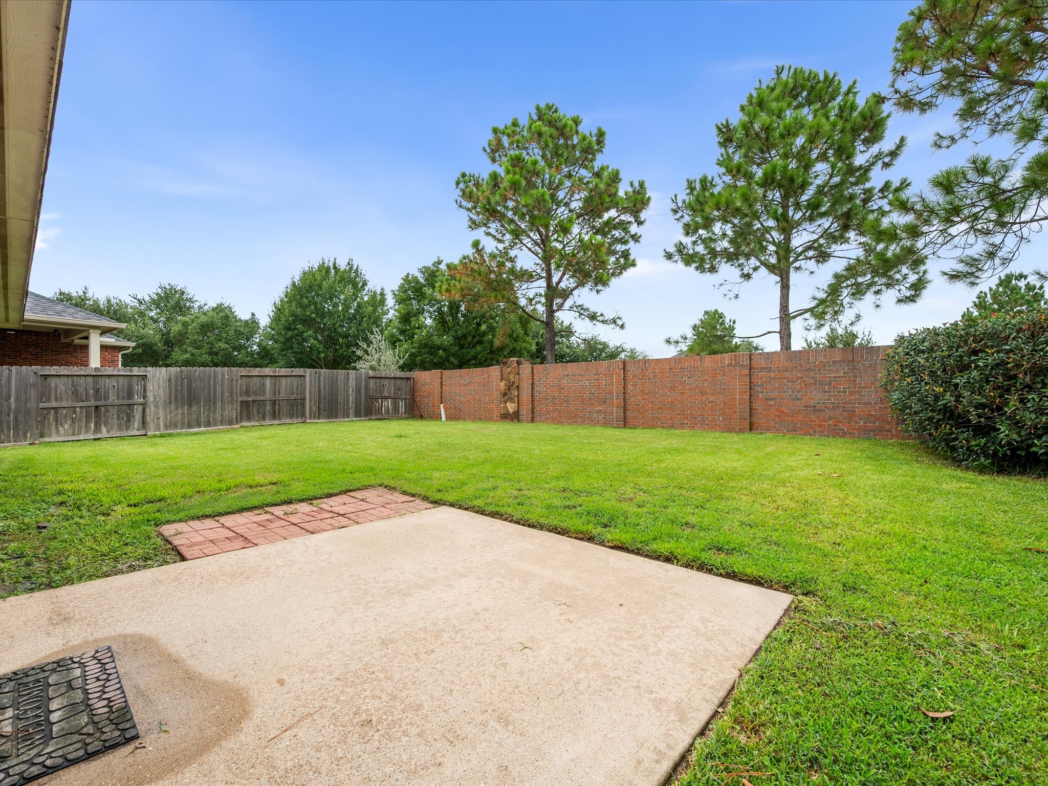 The large fenced backyard offers plenty of space to enjoy outdoor activities, entertain guests, or create your own private retreat.