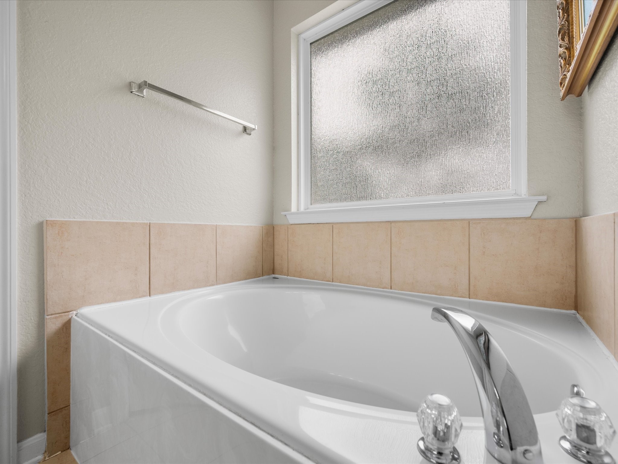 Unwind at the end of the day in the private primary ensuite featuring a relaxing soaking tub designed for comfort and everyday retreat.