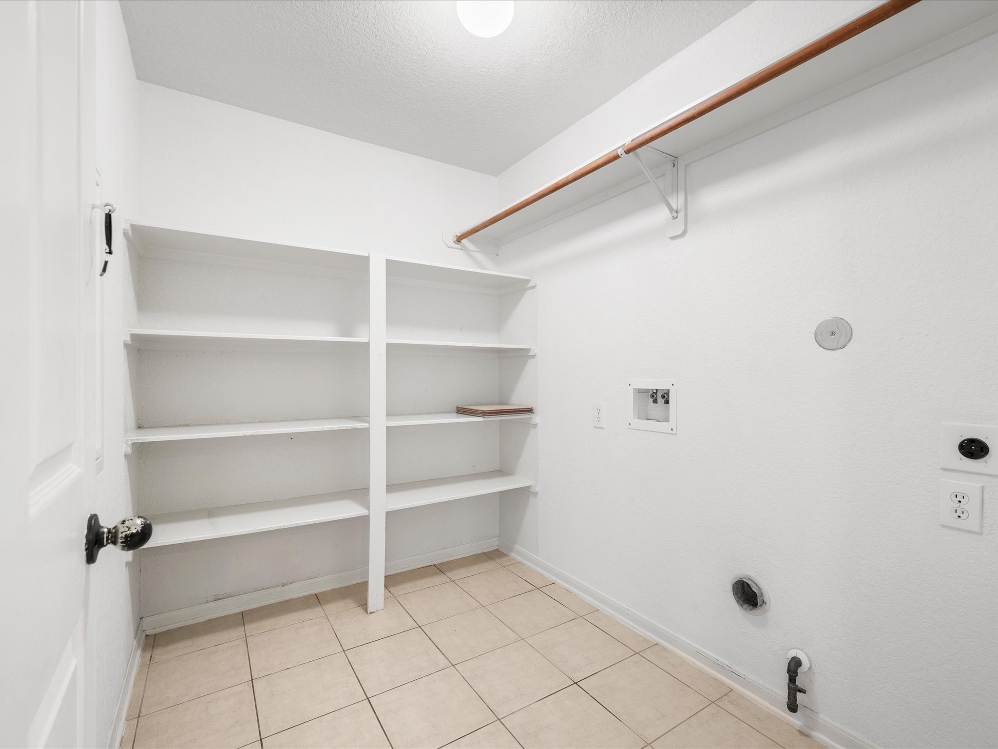 The spacious laundry space provides convenience and functionality for everyday household needs.