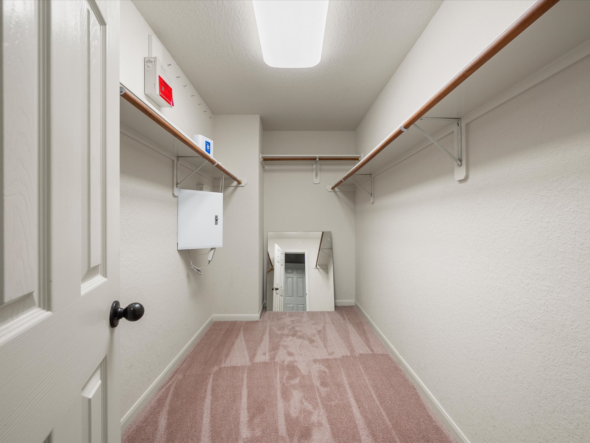 The expansive primary walk-in closet provides excellent storage space and room to keep everything organized with ease.