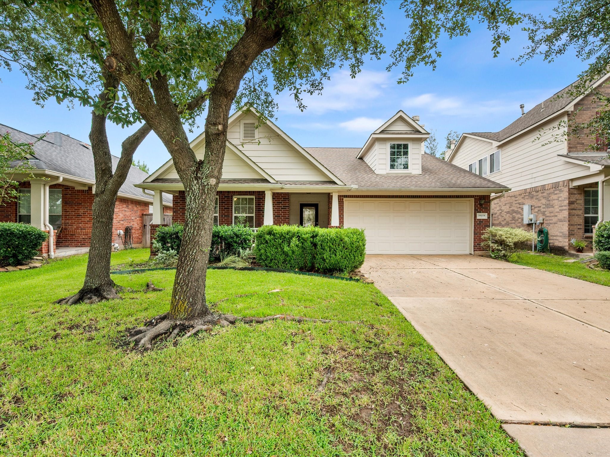 A beautifully maintained exterior welcomes you home with mature trees, a well-kept lawn, and the timeless appeal of the Gleannloch Farms community.