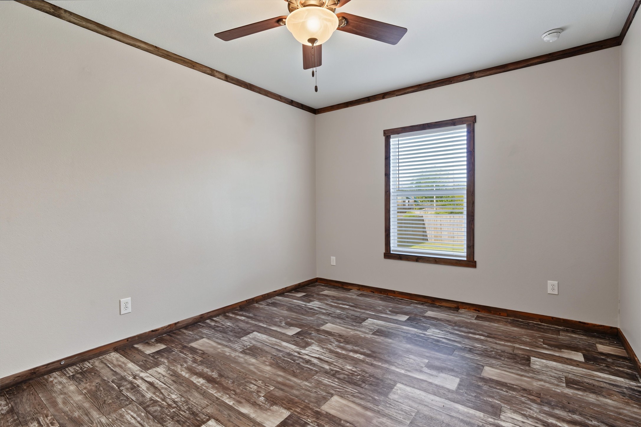 Spacious Bedroom with Walk-In Closet  A generously sized bedroom offering plenty of room for comfortable furnishings, natural light, and the convenience of a large walk-in closet for exceptional storage.