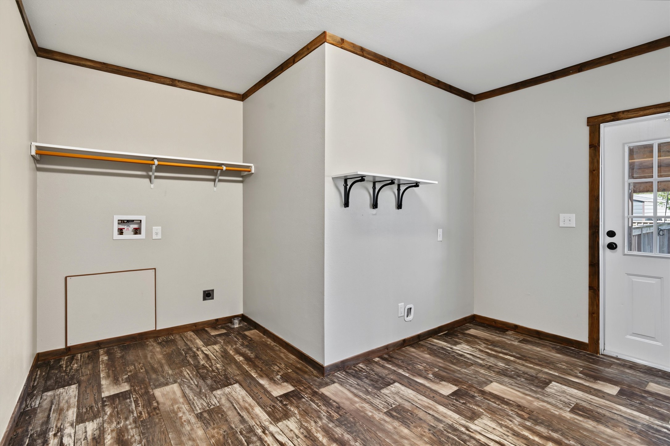 Oversized Utility & Storage Room  Plenty of room for a full-size washer and dryer, abundant storage, and a secondary refrigerator. Convenient backyard access makes this hardworking space even more functional for everyday living