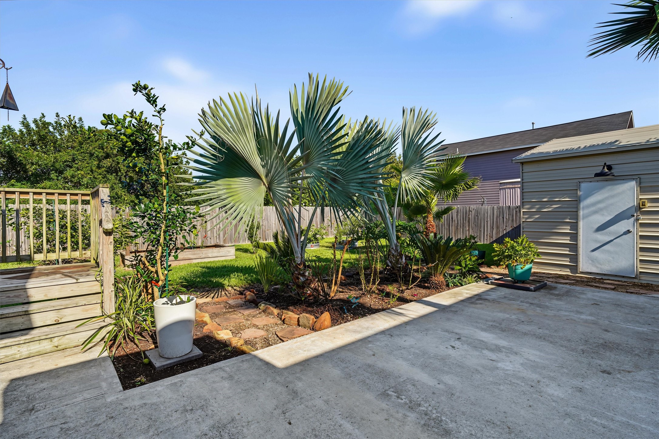 View of concrete patio and landscaping. This backyard just spell RELAX