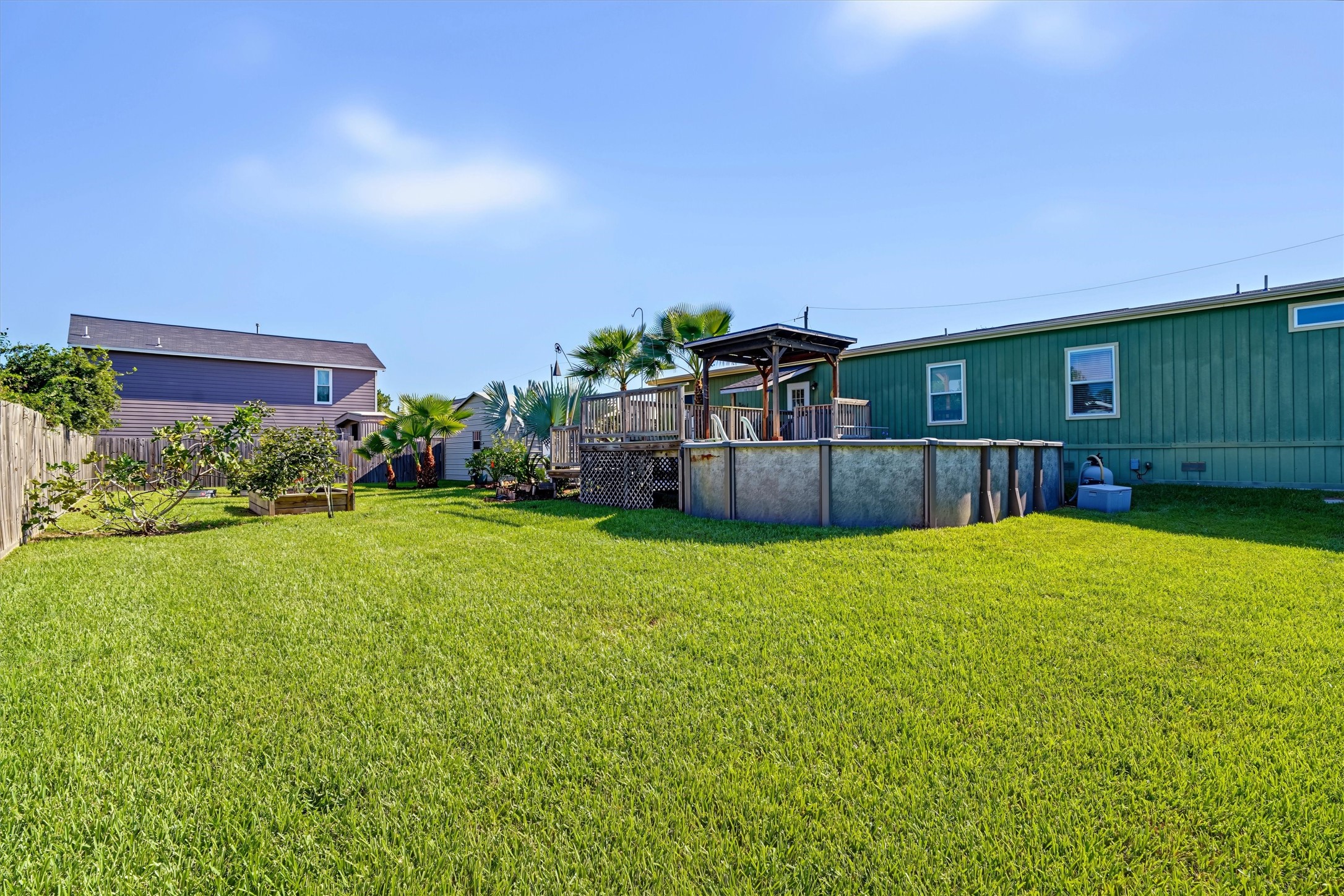 Large Grassy Backyard  Plenty of open space for kids to run and play, dogs to roam, and the whole family to enjoy the outdoors
