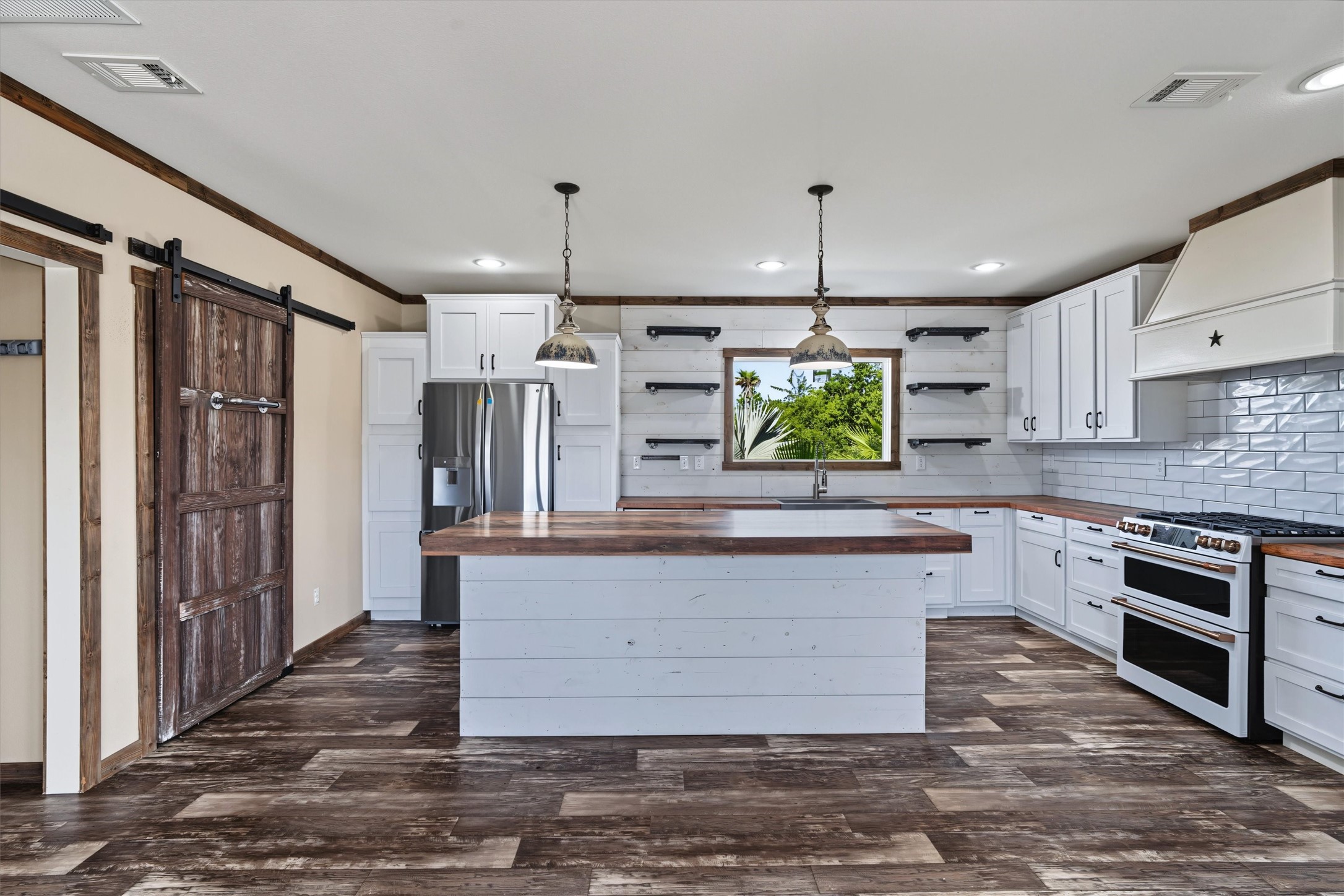 Gorgeous White Kitchen  Beautiful white cabinetry paired with stunning countertops and a stylish backsplash create a bright, fresh, and inviting kitchen thats perfect for both everyday living and entertaining