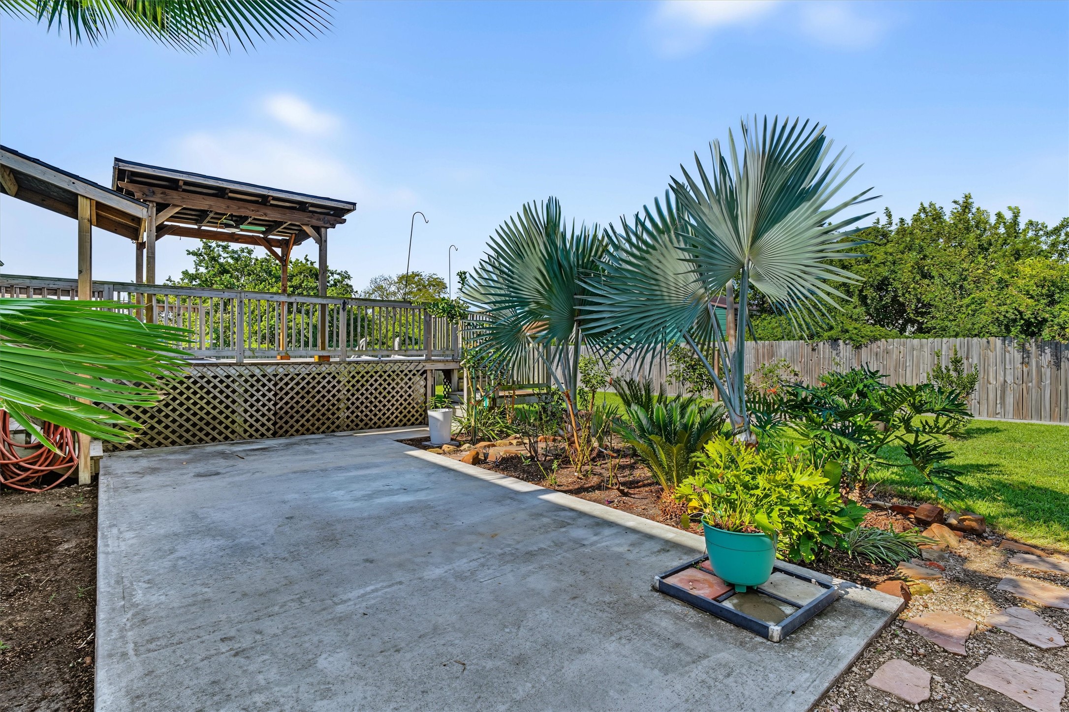 Beautifully Landscaped Backyard Oasis  A beautifully landscaped backyard retreat with a spacious patio thats perfect for outdoor dinners, entertaining guests, and enjoying relaxing evenings outdoors