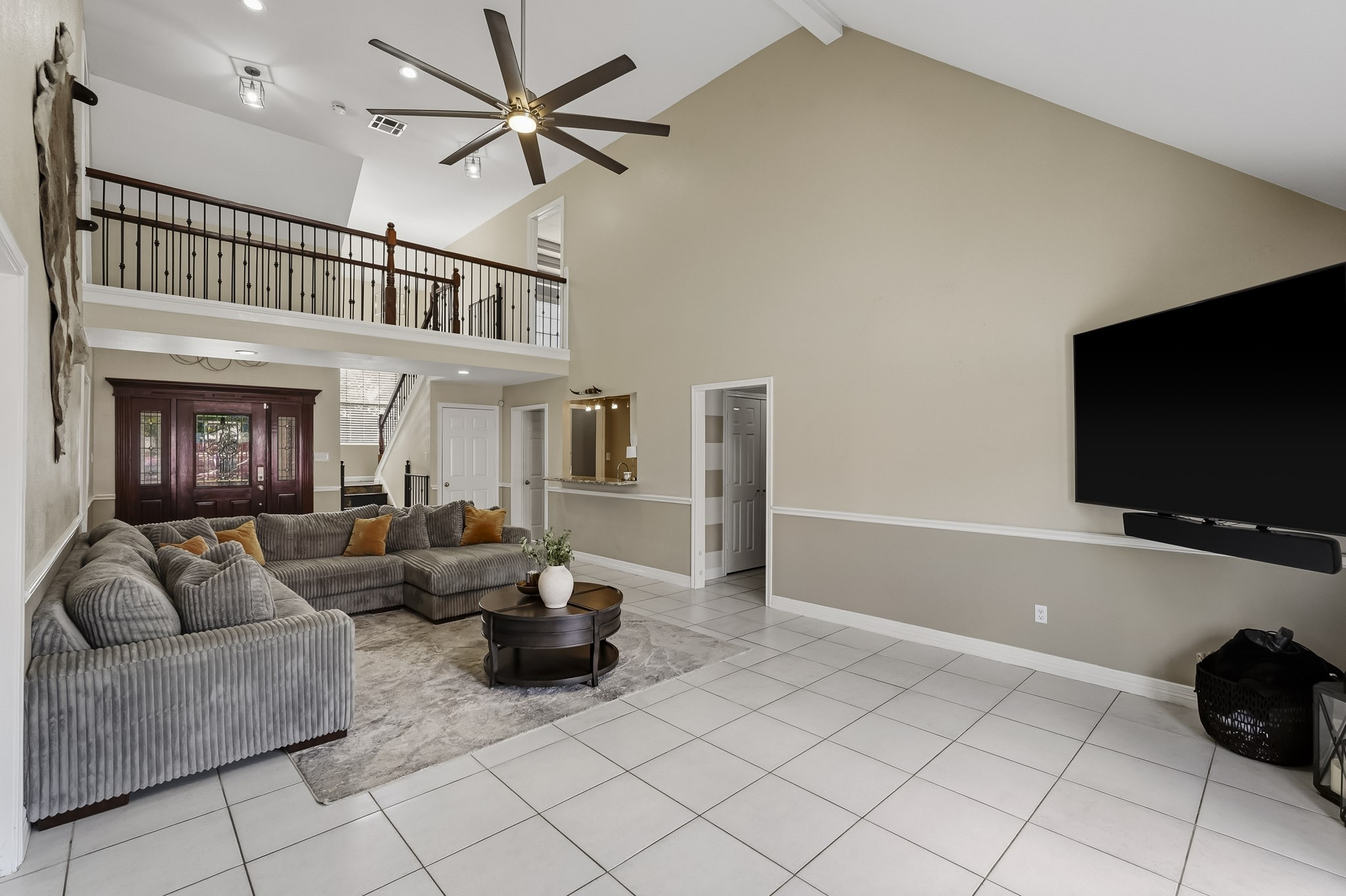 Spacious living room with high ceilings.