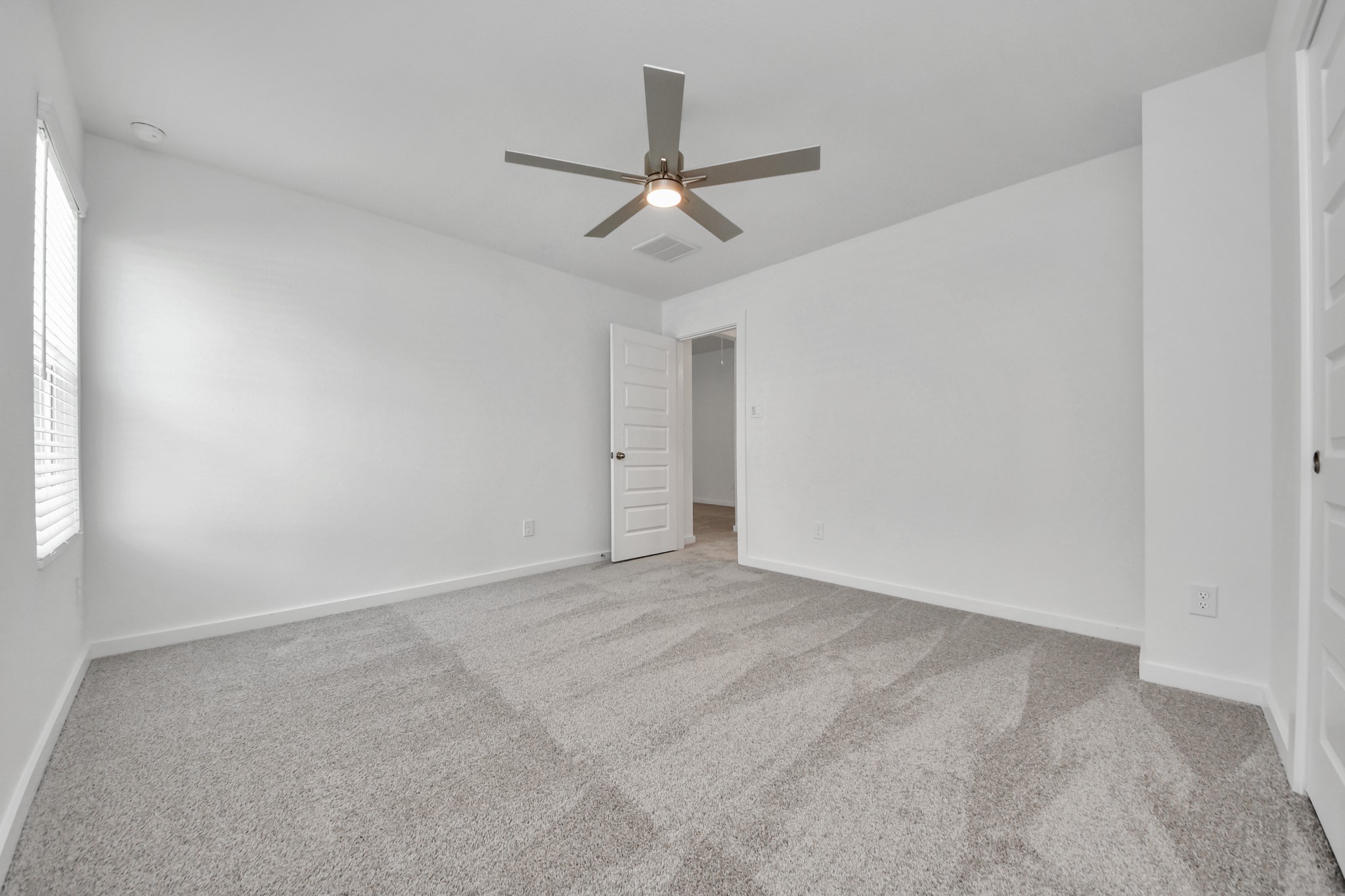 Secondary bath features tile flooring, bath/shower combo with tile surround, light stained wood cabinets, beautiful light countertop. Sample photo of completed home with similar floor plan. Actual colors and selections may vary.