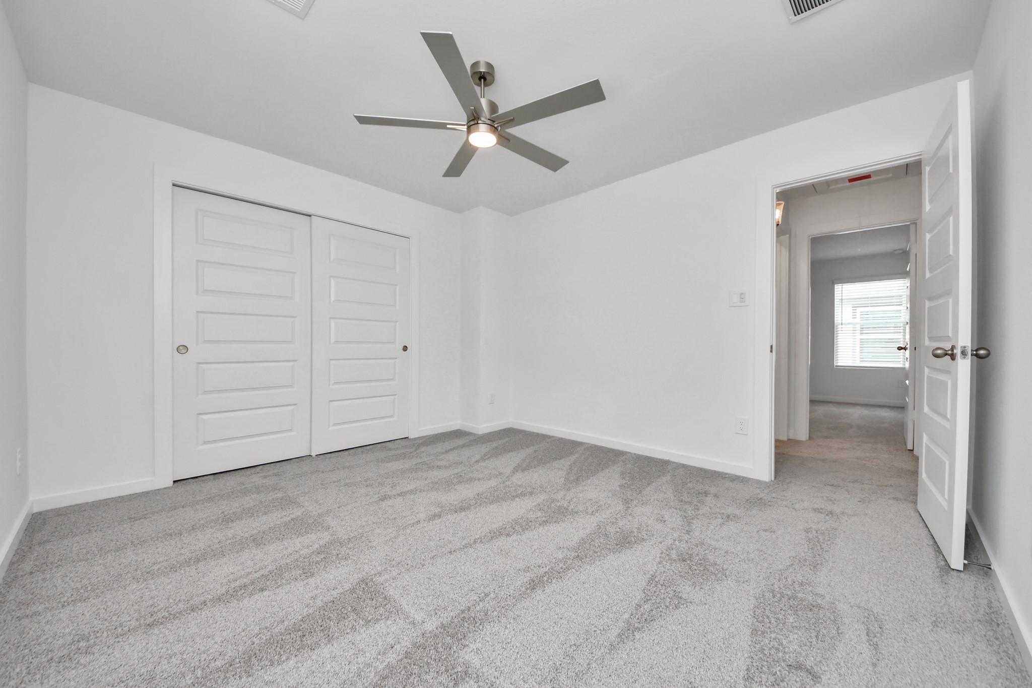 A perfect blend of functionality and comfort. Capture the essence of easy living with a first-floor laundry room, thoughtfully equipped with shelving for effortless organization. Both electric and gas connections available. Sample photo of completed home with similar floor plan. Actual colors and selections may vary.