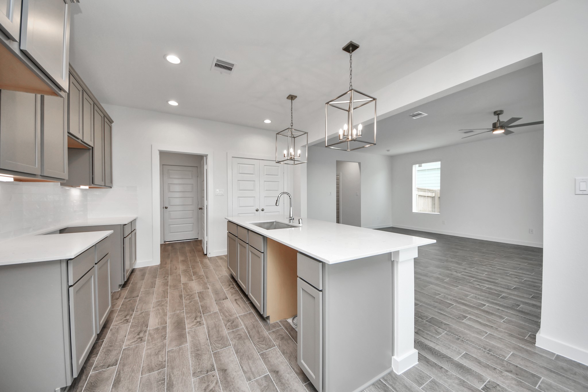 The open concept effortlessly connects the kitchen to the expansive family room, forming a perfect hub for gatherings. This seamless flow creates an inviting space where cooking and socializing come together harmoniously. Sample photo of completed home with similar floor plan. Actual colors and selections may vary.