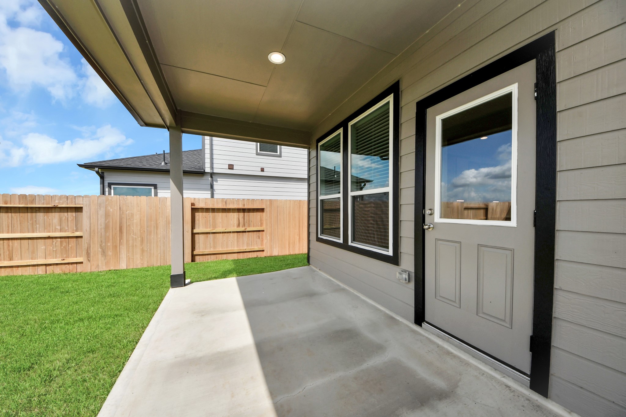 As you step into the threshold of this luxurious home, you'll soon be welcomed by an elegant glass door (to be installed). Inside, soaring ceilings amplify the spaciousness, while the refined wood-look tile flooring and oversized baseboards exude sophistication and charm. Sample photo of completed home with similar floor plan. Actual colors and selections may vary.