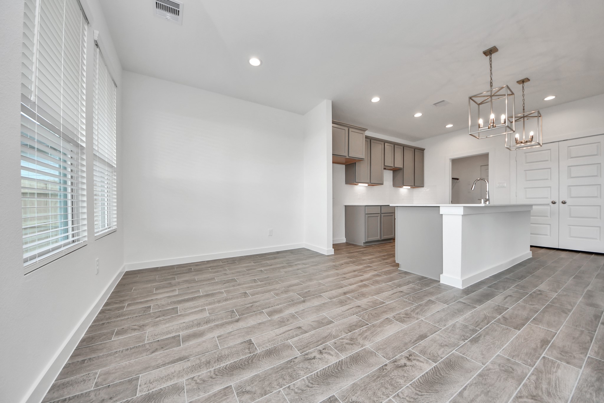 Enjoy breakfast with ease in the connected and cozy breakfast area, seamlessly integrated with the kitchen for utmost convenience. Step through the back door for a breath of fresh air onto the covered patio, extending your living space to the outdoors. Sample photo of completed home with similar floor plan. Actual colors and selections may vary.