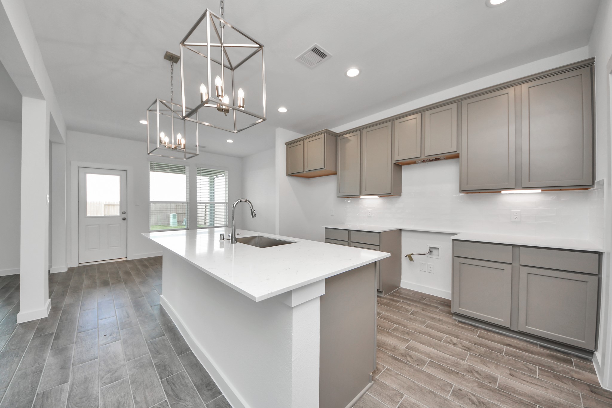 This generously spacious kitchen is a dream realized! Sample photo of completed home with similar floor plan. Actual colors and selections may vary.