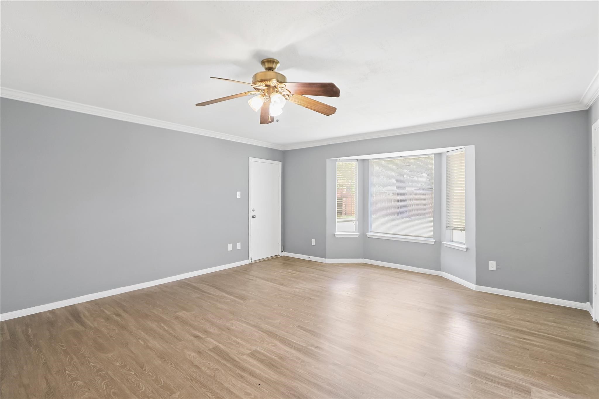 Beautiful bay windows and access to the backyard from the primary bedroom.
