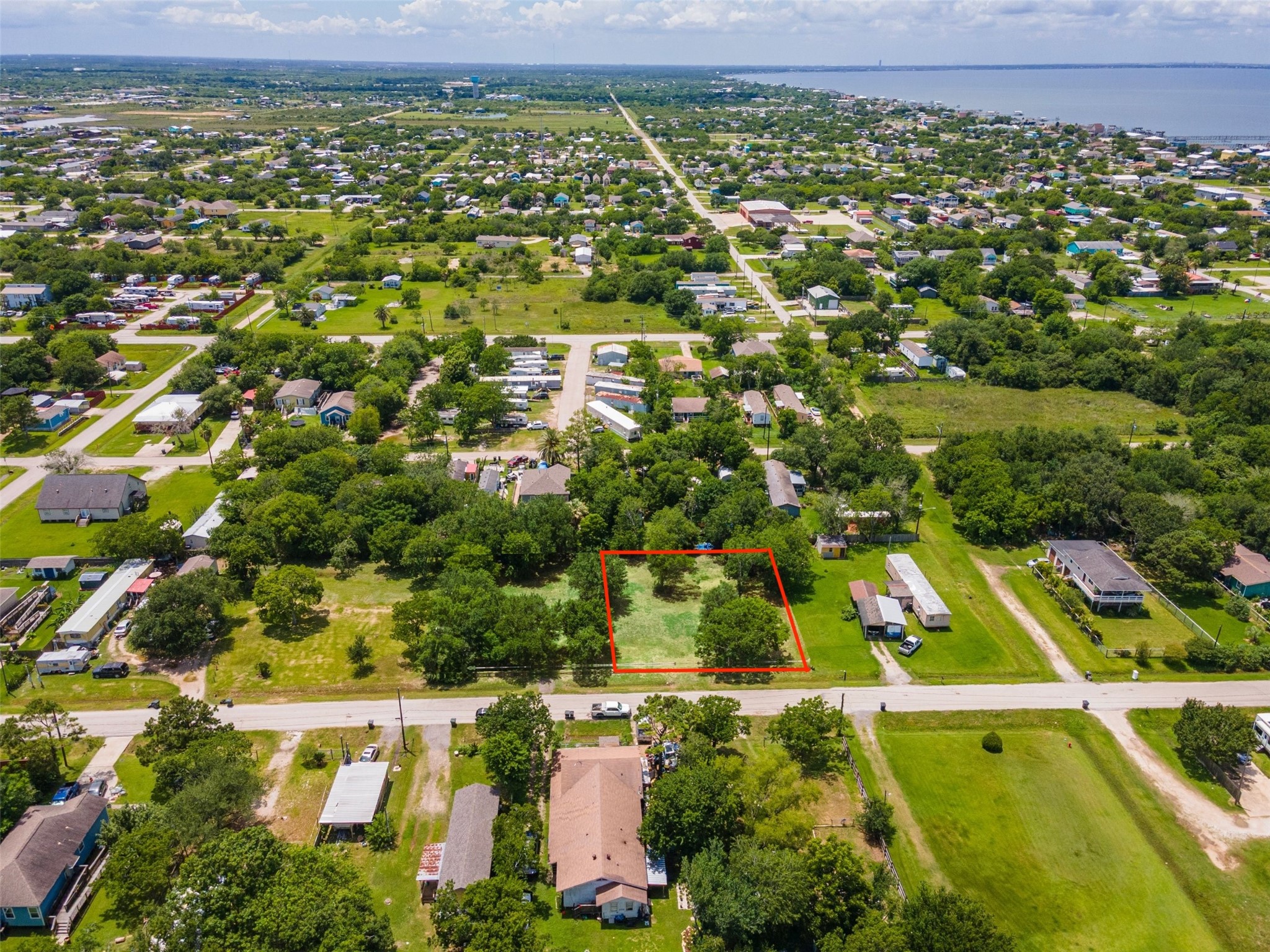 Birdseye view (Galveston Bay in background) of Lots 29, 30, 31 & 32 (12,798 SF). Red boarder is for visual purposes only and does not signify exact lot boundaries.