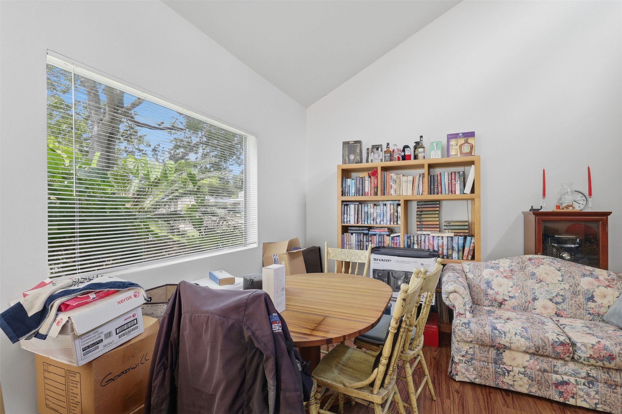 High vaulted ceilings paired with a large garden window make this sunny corner perfect for a home office, study, or reading nook.