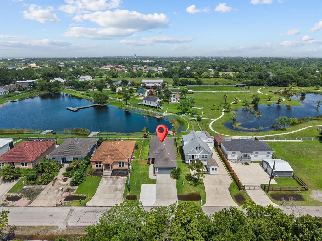 Aerial shot of this charming home! Enjoy the views of the nearby lakes. Aerial shot of this charming home! Enjoy the views of the nearby lakes.