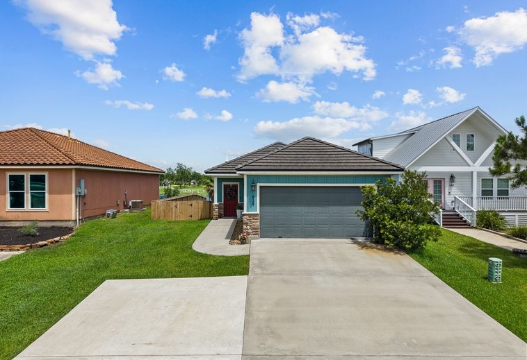 Front elevation! Tile roof, with stone accents make this home really stand out! Front elevation! Tile roof, with stone accents make this home really stand out!