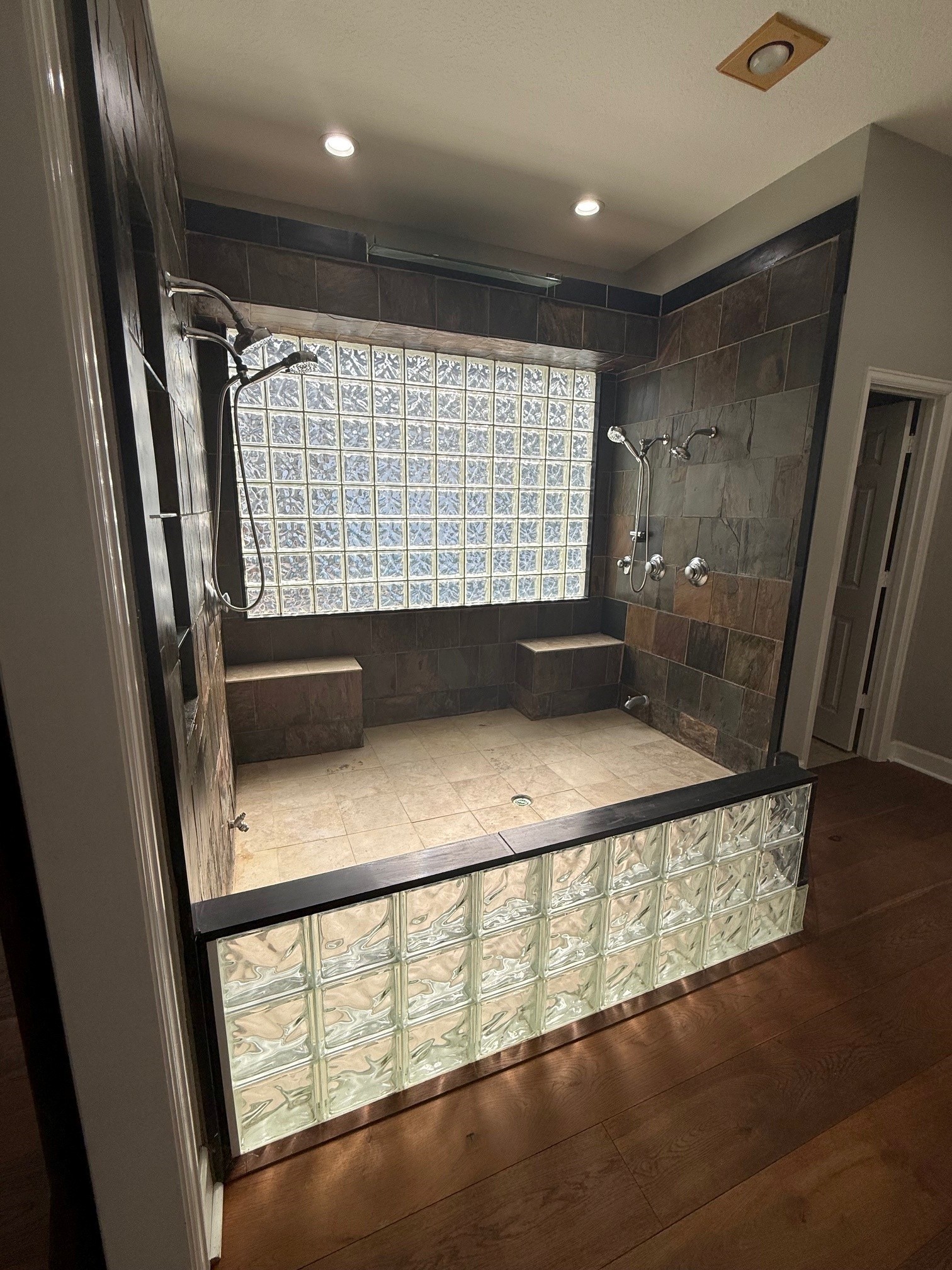 Primary shower is enormous and has a waterfall feature