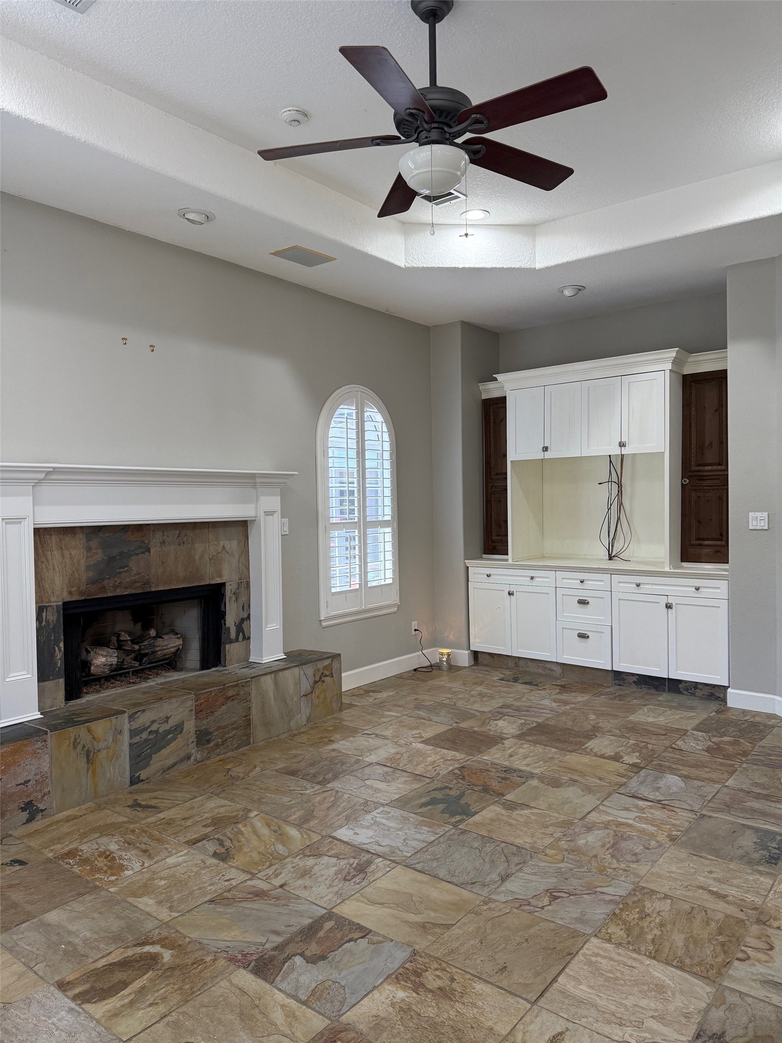 Living room features fireplace and built ins