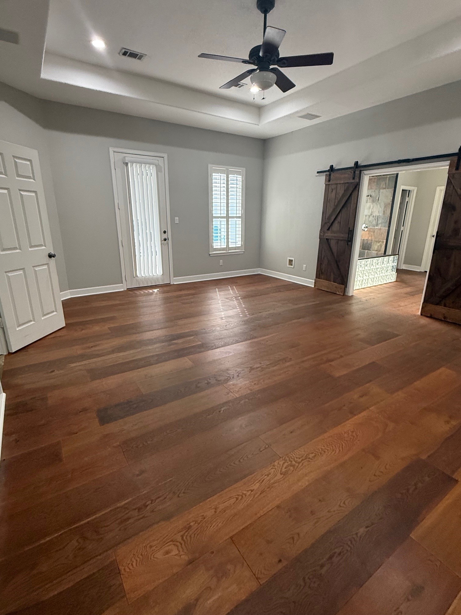 Primary bedroom with door to pool area