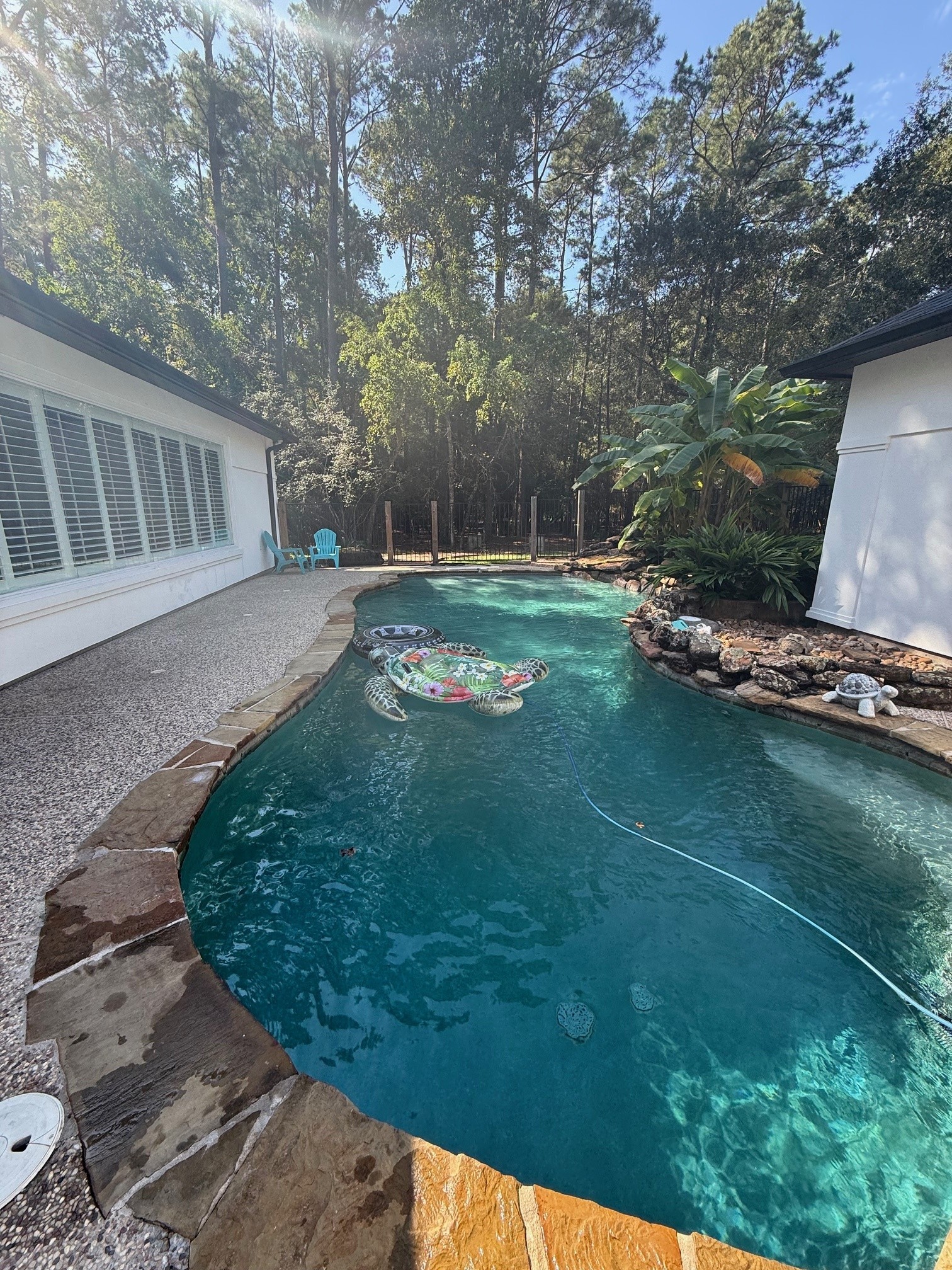 Casita has wall of windows that overlook the pool area