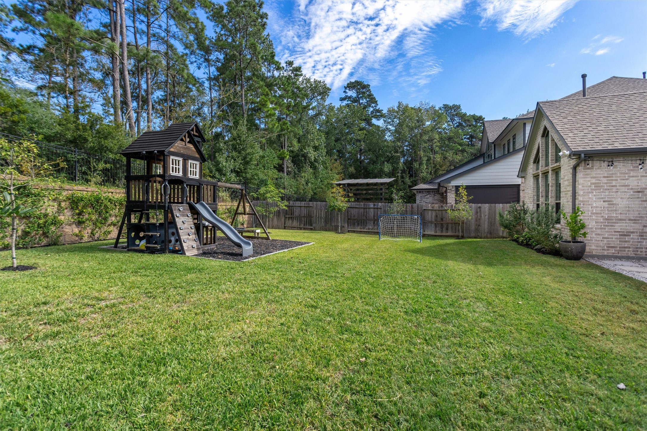 Beyond the extended patio, discover an expansive backyard offering endless possibilities! Perfect for kids to play, outdoor entertaining, or creating your dream poolside oasis, with plenty of room to make it your own.