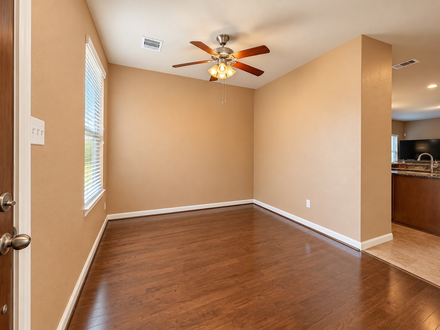 Inviting front dining room with an open flow into the kitchen, perfect for everyday living and entertaining.