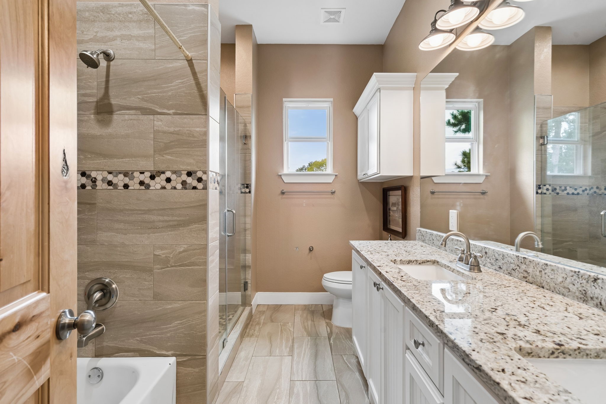 Guest bath with 2 sinks Tub and shower.