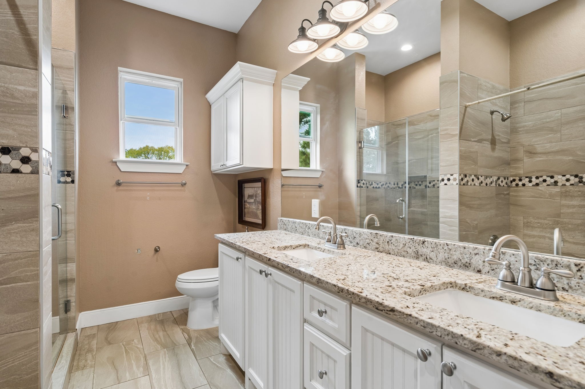 Guest bath with two sinks.
