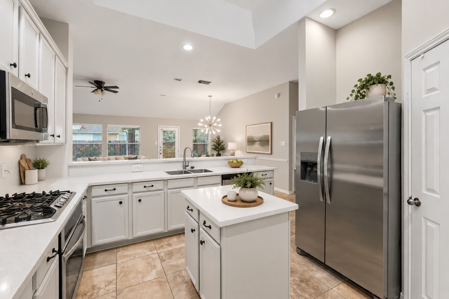 At the heart of the home, the chefs island kitchen boasts 42" cabinetry with crown molding, stainless steel appliances and expansive countertops