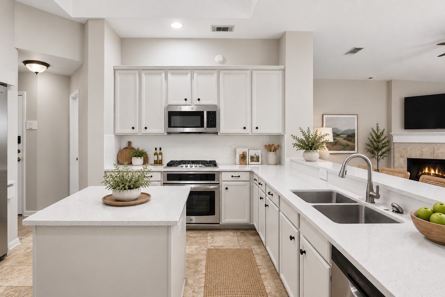 At the heart of the home, the chefs island kitchen boasts 42" cabinetry with crown molding, stainless steel appliances and expansive countertops