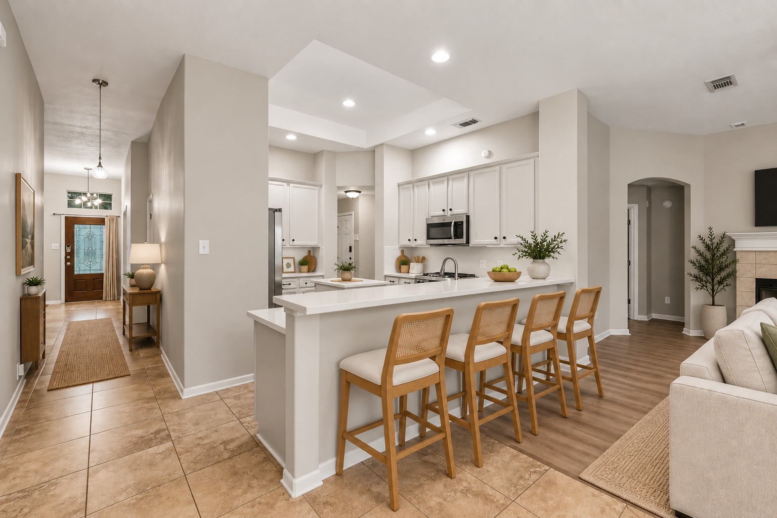 At the heart of the home, the chefs island kitchen boasts 42" cabinetry with crown molding, stainless steel appliances and expansive countertops
