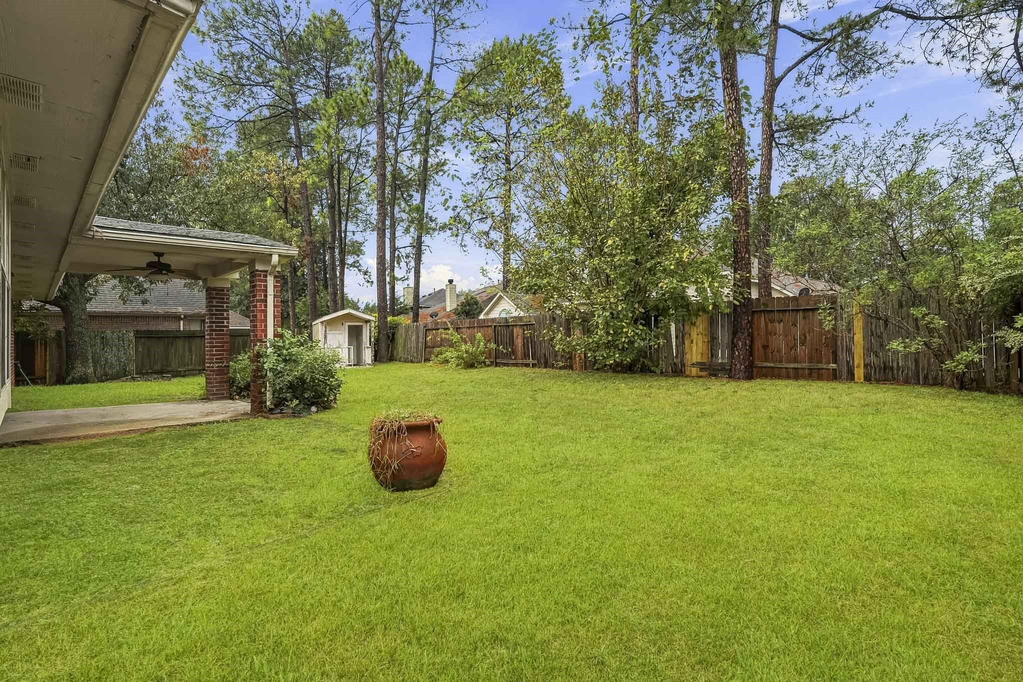 Enjoy a large backyard with a covered patio, perfect for relaxing or entertaining.