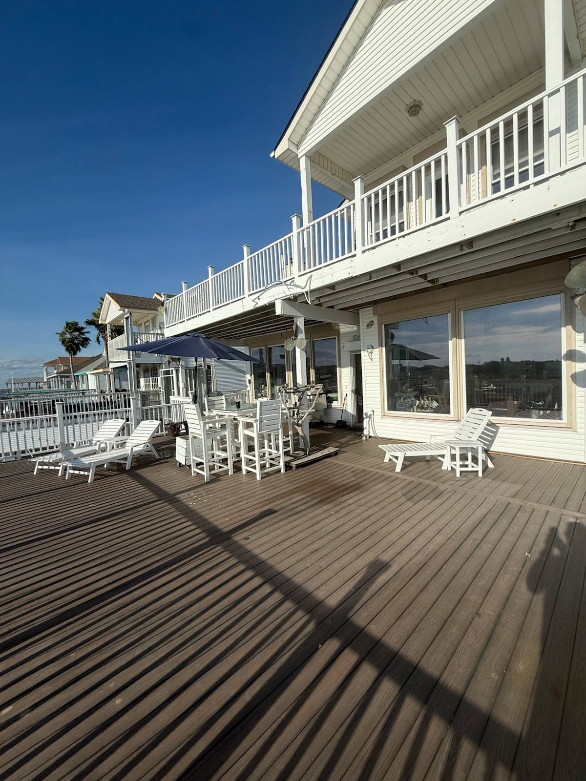 Waterside deck and rear exterior Waterside deck and rear exterior