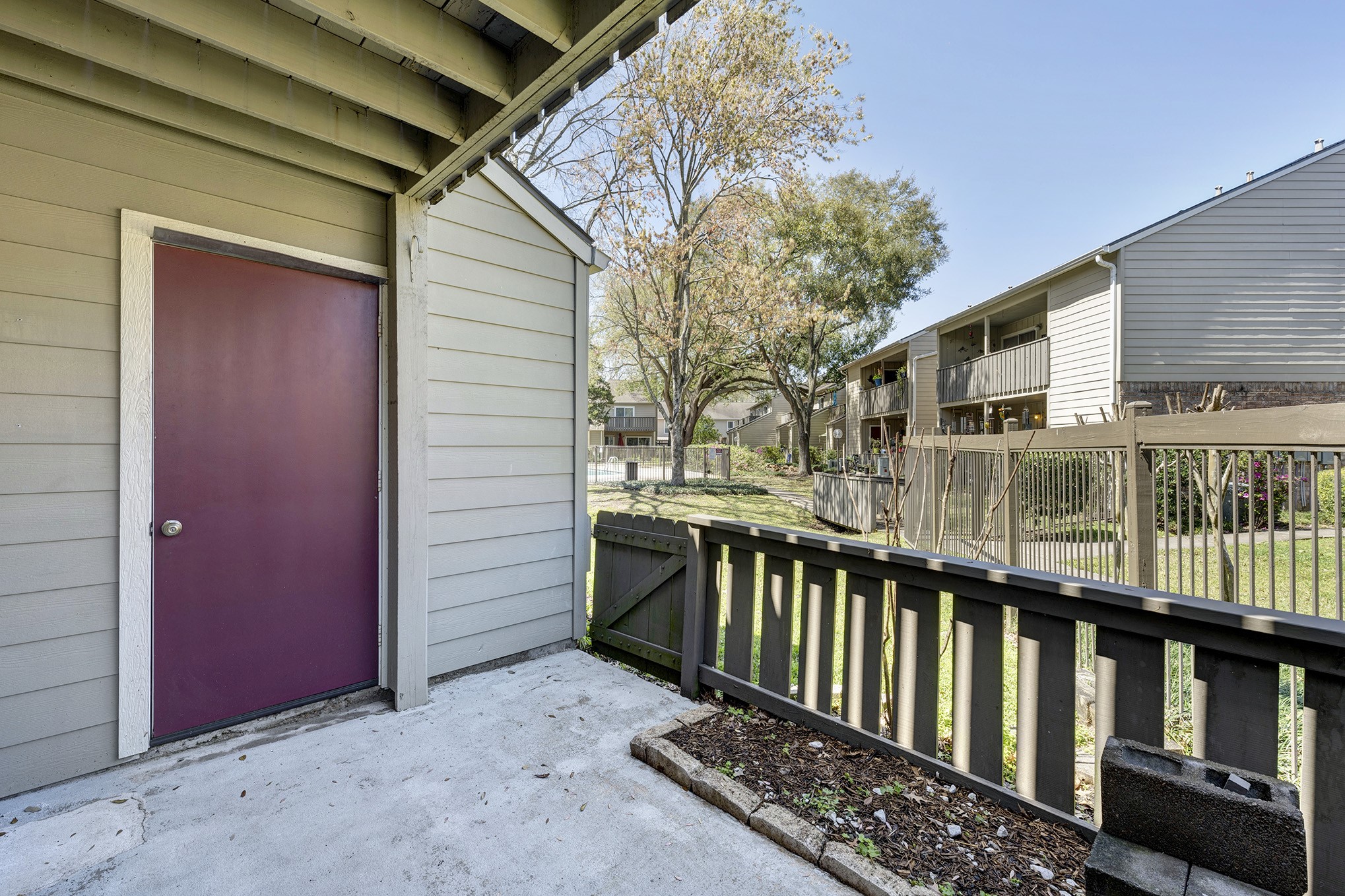 Patio off the living room with storage closet.