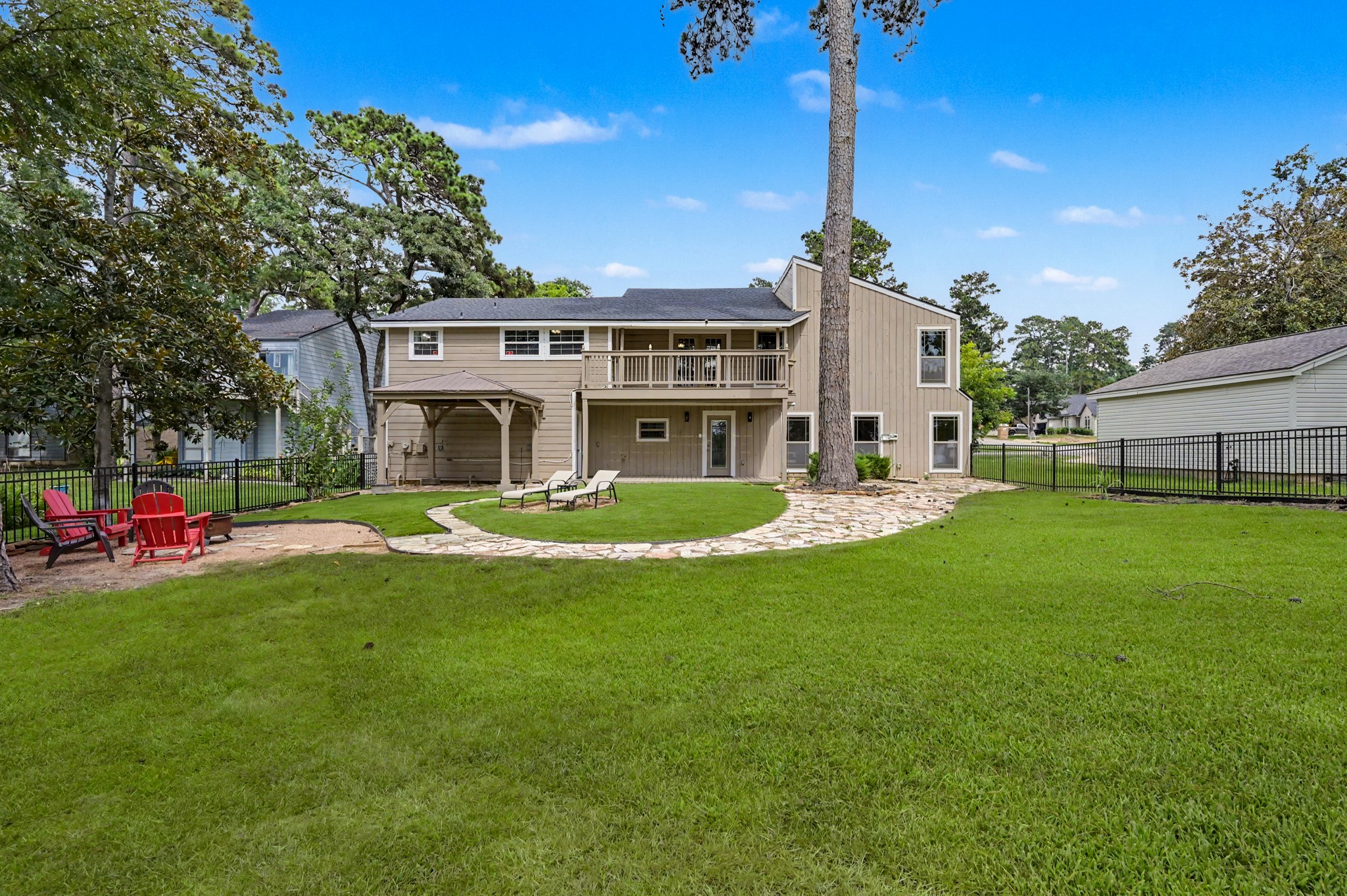 Fresh paint on the balcony, open porch and gazebo. Imagine all the fun you could have in this yard!
