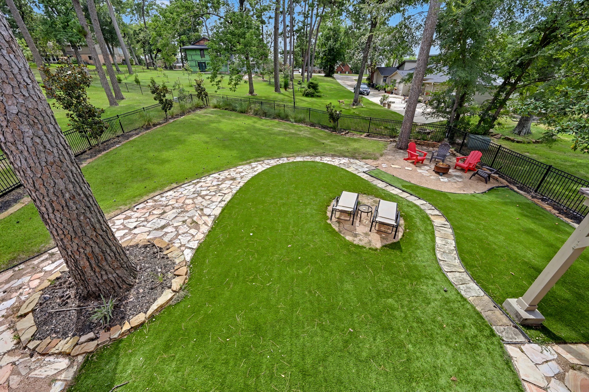 Both artificial turf AND natural grass give pets and people the best of both worlds. New firepit area added in early spring 2026.