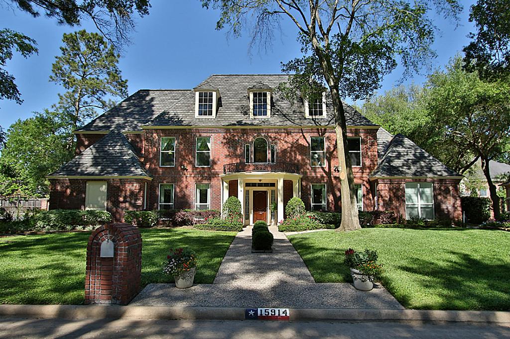 STATELY ELEVATION WITH ALMOST ALL BRICK.  This amazing estate is spread over 13,000 sqft of meticulous mature landscaping.  A three car garage is just on the the other side of the automated gate.  .