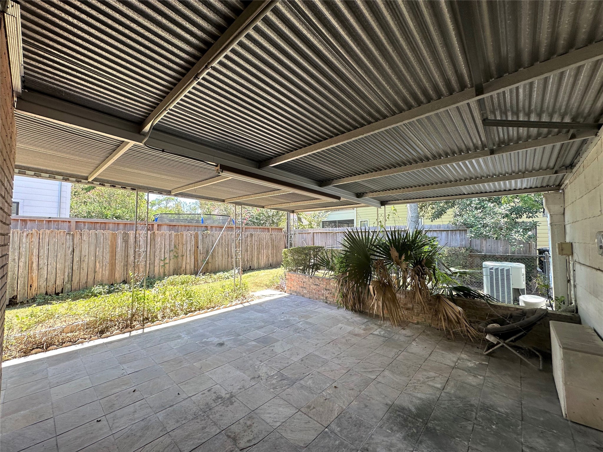 Large back covered patio with access from both the additional living area/den and the breakfast/dining area.  Plenty of room for sitting area and patio table to relax and entertain back here!