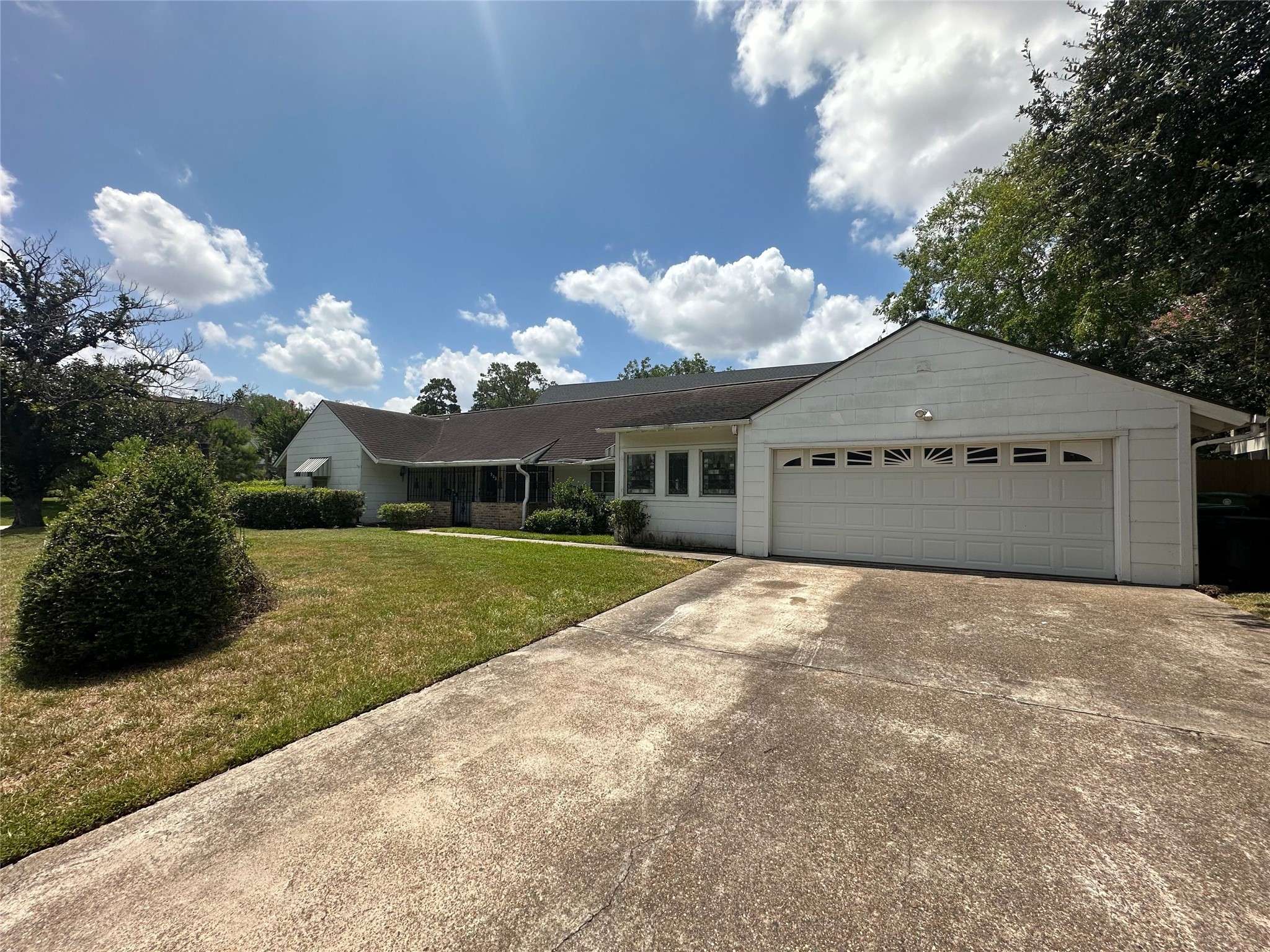 Long, double-wide driveway provides plenty of off-street parking.