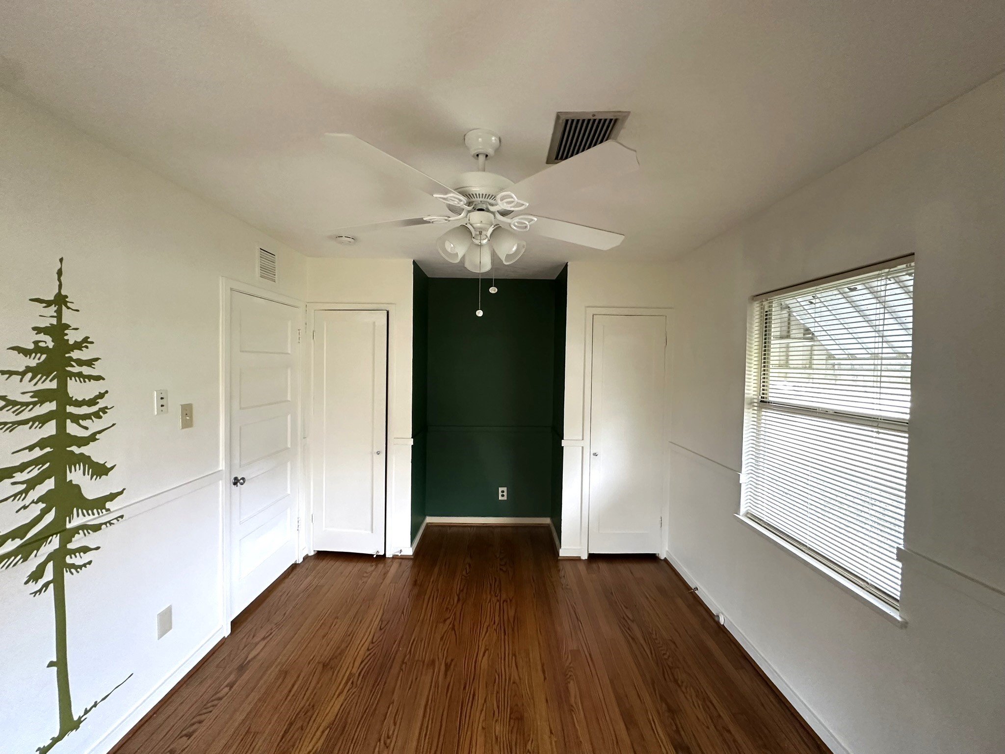 Bedroom #2 has double closets and alcove for dresser or tv cabinet.