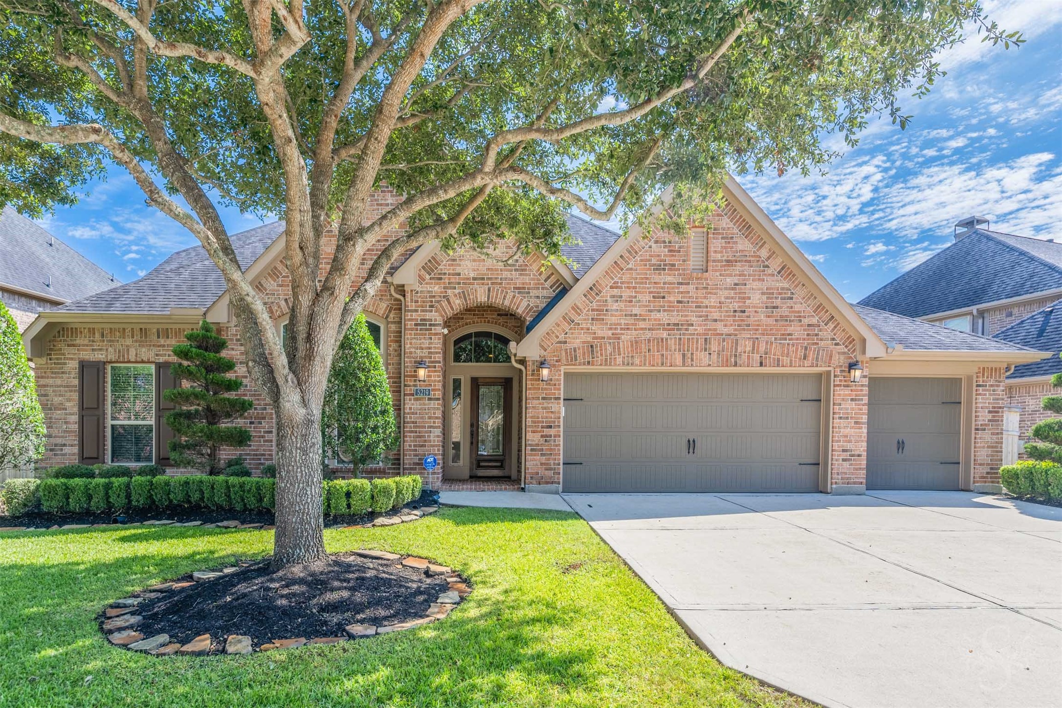 Elegant 1.5 story Perry home in Cross Creek Ranch offers 4 bedrooms, 3.5 baths & a 3 car garage, framed by mature trees and beautifully manicured landscaping.