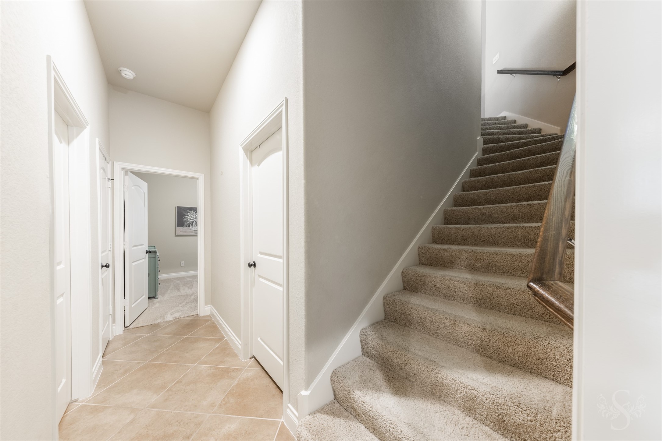 Tucked off the hallway, the carpeted staircase leads to the homes upstairs retreat. A spacious game room and separate media room provide a wonderful destination for family fun and entertaining friends.