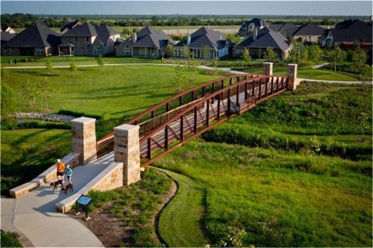 A signature landmark of Cross Creek Ranchthe scenic bridge at Flewellen Creek connects miles of walking trails and expansive green space. Framed by lush landscaping and serene views, its the perfect place for morning jogs, evening strolls, or simply soaking in the natural beauty of the community.