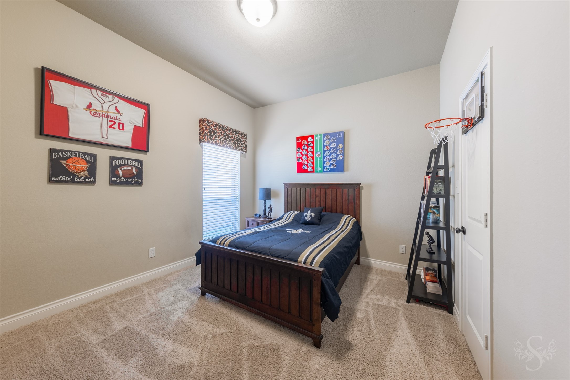 This generously sized secondary bedroom offers a comfortable retreat with soft carpeting and a soothing neutral palette. The spacious layout provides flexibility for bedroom furniture and a dedicated spot for reading or studying.